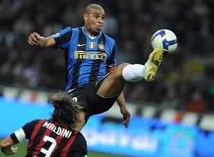 Inter Milan's Adriano (R) vies for the ball with AC Milan's Paolo Maldini during their Serie A football match at Milan's San Siro Stadium on September 28, 2008. AFP PHOTO/ Filippo MONTEFORTE (Photo credit should read FILIPPO MONTEFORTE/AFP/Getty Images)