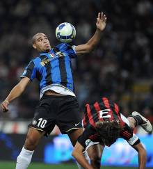 Inter Milan's Adriano (L) fights for the ball with AC Milan's Paolo Maldini during their Serie A football match at Milan's San Siro Stadium on September 28, 2008. AFP PHOTO/ Filippo MONTEFORTE (Photo credit should read FILIPPO MONTEFORTE/AFP/Getty Images)